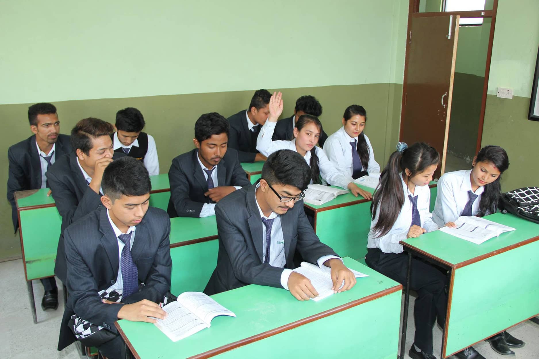 Students studying in a classroom at Supreme Academy